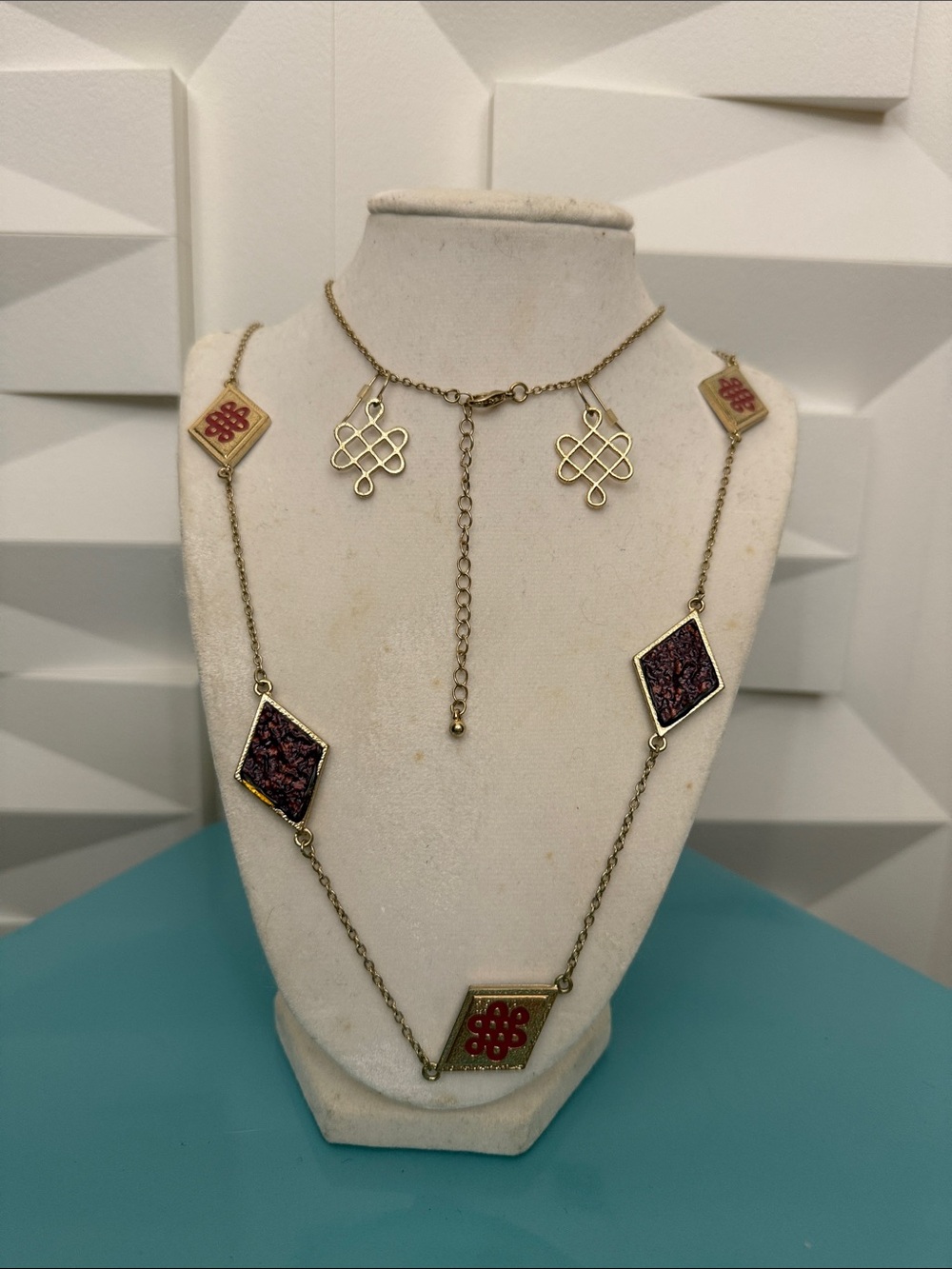 Endless Knot red and gold-tone necklace and earrings